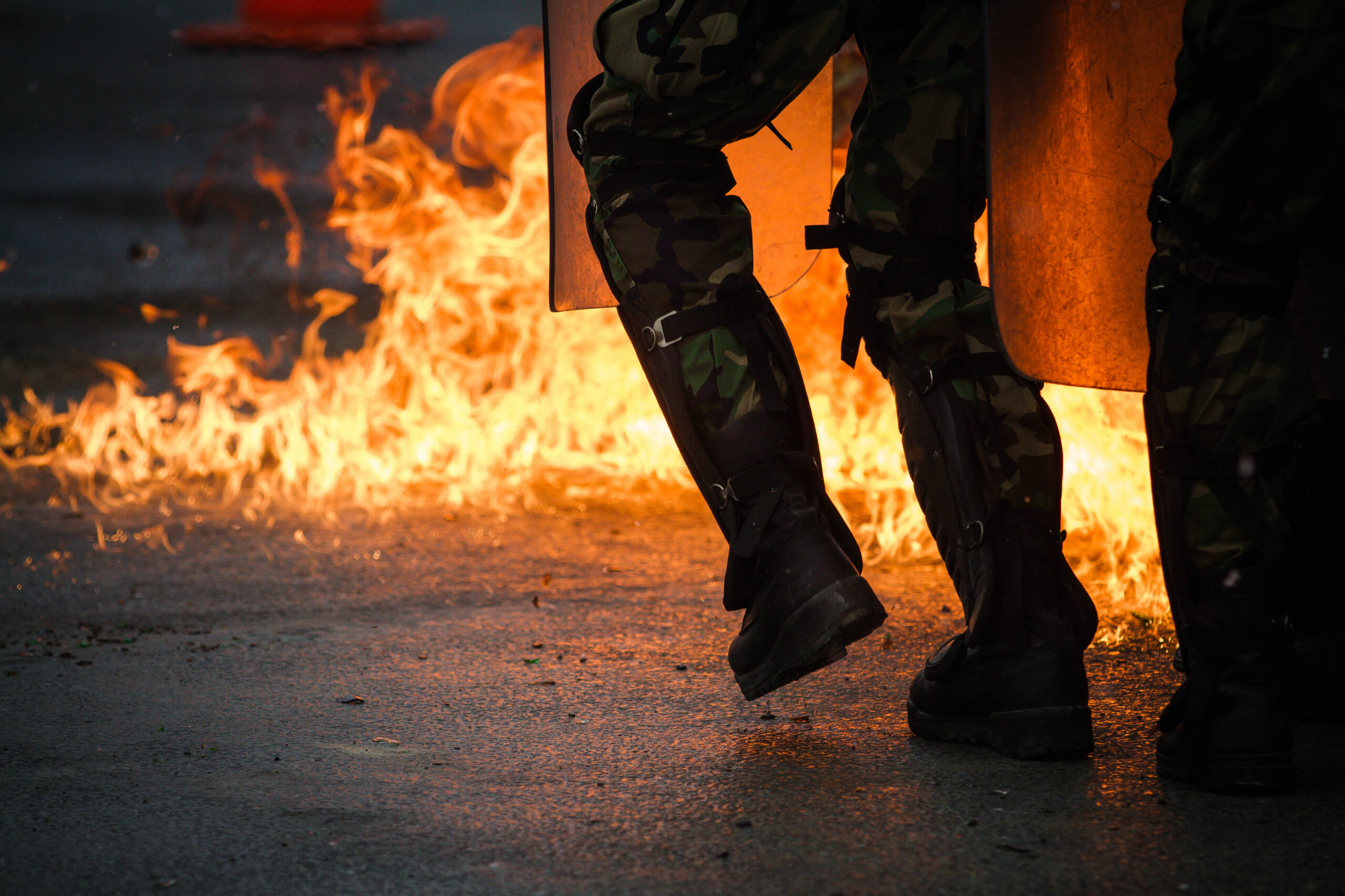 A unit of Moldavian soldiers push through a wall of fire Feb. 17 during fire-phobia training. As part of their pre-KFOR deployment, multinational and United States service members pass through the joint Multinational Readiness Center, where they must complete a rigorous series of training scenarios before moving on to the NATO KFOR operation. The KFOR MRE 21 is based on the current operational environment and is designed to prepare the unit for peace support, stability and contingency operations in Kosovo in support of civil authorities to maintain a safe and secure environment. (U.S. Army photo by Sgt. 1st Class Benjamin Cossel)