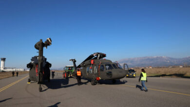 Albania's UH-60A Black Hawks, FA-666 and FA-690, are seen stationed on the ground in what appears to be a runway. All of the helicopters' blades are swooped back, suggesting that the image was taken shortly after it was delivered by the US Air Force's Boeing C-17A airlifter.