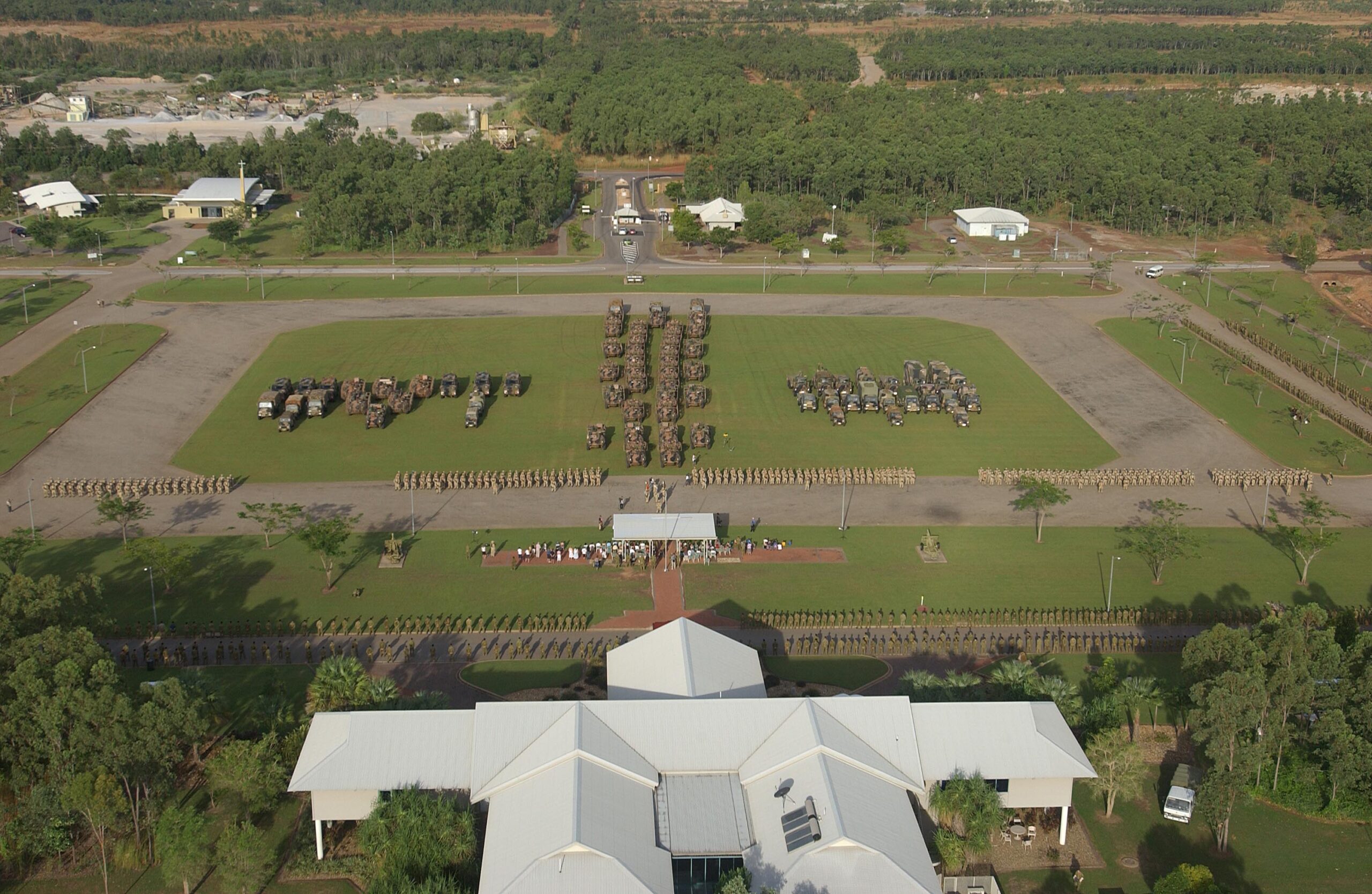 20050408adf8266562_0014.JPG Caption: Deep Caption: Soldiers and their vehicles of the Al Muthanna Task Group (AMTG) parade for the Commander of the 1st Brigade, Brigadier John Cantwell, at Robertson Barracks in Darwin following the completion of their Mission Rehearsal Exercise. The solders are being farewelled prior to their deployment to southeast Iraq, surrounded by their families and fellow members of the 1st Brigade.