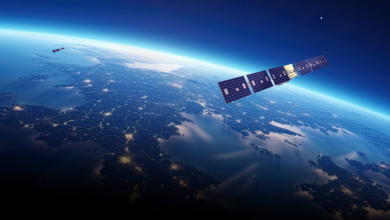 Artist's impression of a satellite in outer space. The satellite looms above the earth.
