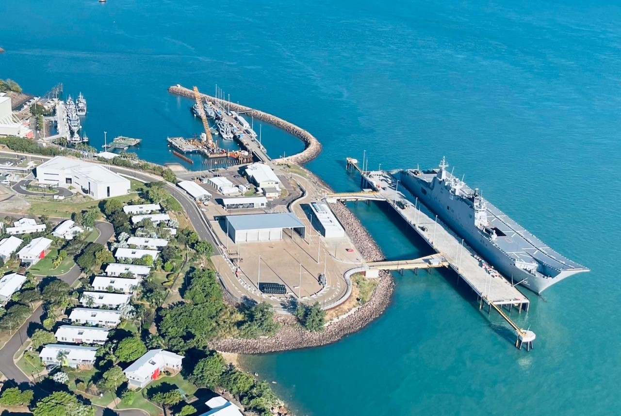 HMAS Adelaide berths alongside the new Kuru Wharf at HMAS Coonawarra in Darwin, NT. *** Local Caption *** HMAS Adelaide conducted the first Landing Helicopter Dock (LHD) sized berthing alongside the brand new Kuru Wharf at HMAS Coonawarra, Darwin, NT. This event marks a significant achievement regarding ongoing upgrades of waterfront facilities at Larrakeyah Defence Precinct. The Kuru Wharf measures at approximately 250 metres in length, with two approach jetties. The new wharf is now able to support up to Landing Helicoper Dock size naval vessels, providing game-changing capability support in the North.