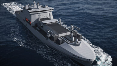 An artist's rendering of a Fleet Solid Support Ship. The gray ship is seen sailing in calm, deep blue waters.