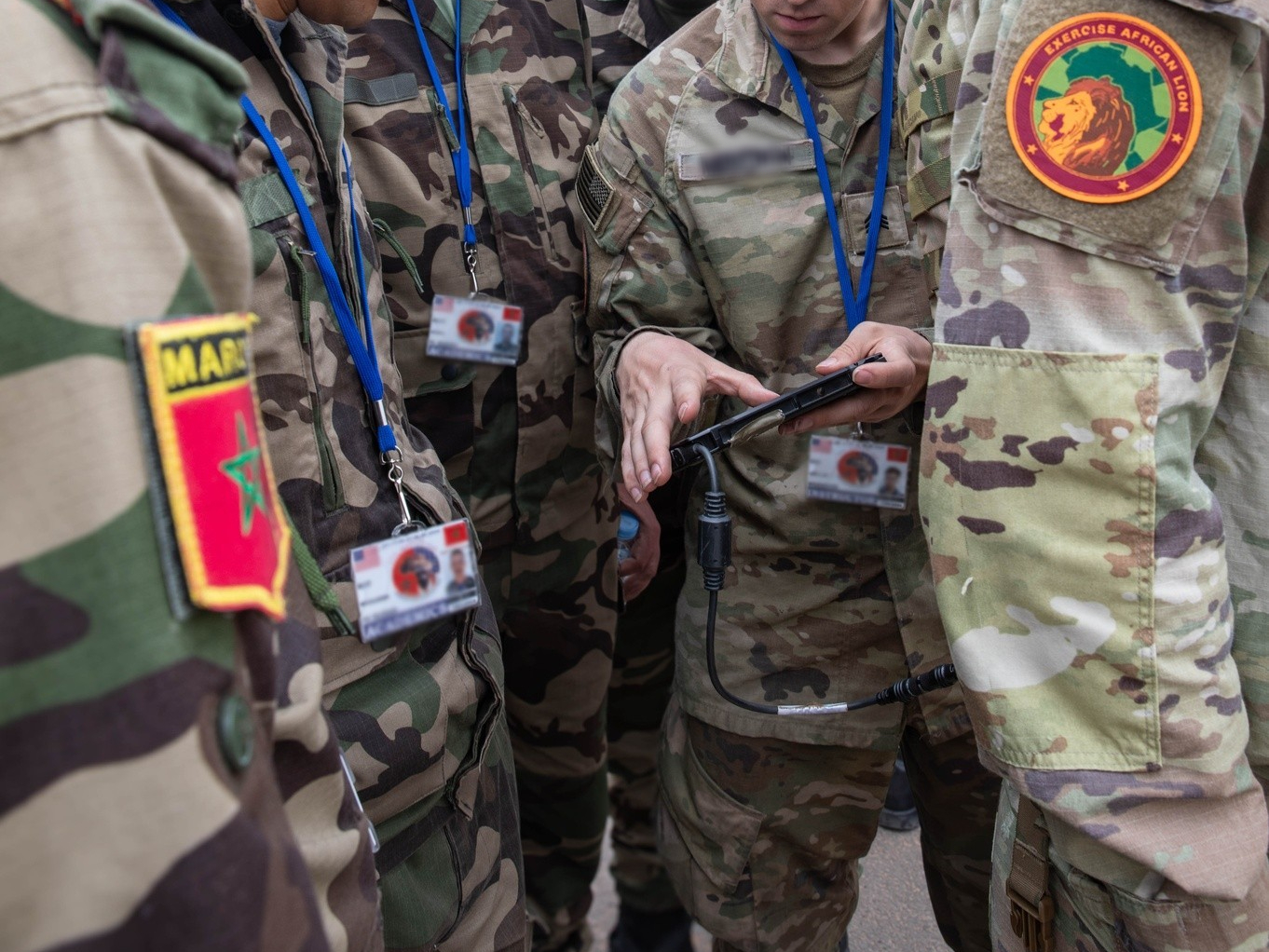U.S. Army Sgt. Andrew Meredith, a cyber operations specialist attached to the 11th Cyber Battalion, U.S. Army Cyber Command, stationed at Fort Eisenhower, Georgia, demonstrates signal detection and direction-finding techniques to service members of the Moroccan Royal Armed Forces during electronic warfare training at La Caserne Tifnit barracks, Tifnit, Morocco, May 15, 2024. African Lion 2024 marks the 20th anniversary of U.S. Africa Command’s premier joint exercise led by U.S. Army Southern European Task Force, Africa (SETAF-AF), running from April 19 to May 31 across Ghana, Morocco, Senegal and Tunisia, with over 8,100 participants from 27 nations and NATO contingents. (U.S. Army photo by Sgt. Alisha Grezlik)