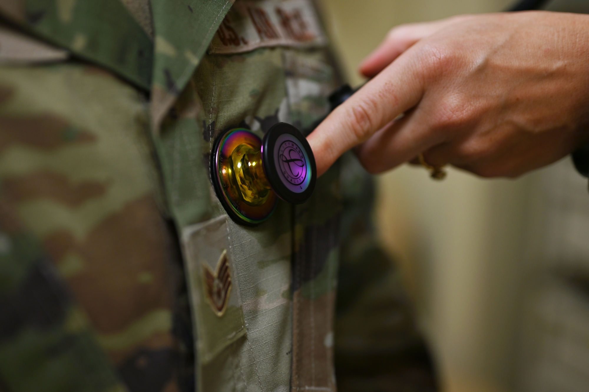 U.S. Air Force 1st Lt. Sarah Hirsch, a physician assistant with the 62d Medical Squadron, checks a patient's heartbeat with a stethoscope at the Warrior Operational Medicine Clinic at Joint Base Lewis-McChord, Washington, July 6, 2023. Hirsch received recognition from her peers for her continuous positive outlook, ability to foster unit cohesiveness and for developing a crossfit training program for the 62d Aerial Port Squadron. (U.S. Air Force photo by Senior Airman Colleen Anthony)