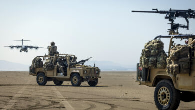 Pictured: Members of the Pathfinder Platoon, 16 Air Assault brigade provide all round protection in RWMIK’s whilst the RAF ATLAS C.1 performs touch & go landings at Pembrey Sands beach. The reconnaissance troops who are first in for the British Army’s Global Response Force have tested how they can insert behind enemy lines in aircraft landing on impromptu runways. Mounted in heavily armed RWMIK patrol vehicles, troops from Pathfinders - the advance force for 16 Air Assault Brigade - were delivered onto Pembrey Sands in southwest Wales from an RAF ATLAS C.1 (A400M) aircraft. With the beach’s vast expanse exposed at low tide, the aircraft swooped in to land on an area that Pathfinders had identified as firm and large enough to land on and marked for the pilots. With its four engines still running, the aircraft dropped its back ramp for the vehicles to drive off, and then took off after being on the ground for the shortest possible time. The rising tide covered all evidence that the aircraft had ever been there, while Pathfinders quickly moved off into the Welsh countryside. In military jargon this is known as a Rapid Air Landing (RAL) on a Temporary Landing Zone (TLZ). For the aircraft of the RAF’s Air Mobility Force to be able to conduct these operations gives greater flexibility in how troops can be delivered on to an operation, in a more covert way and without being restricted to permanent runways that can be defended by enemy troops. Pathfinders are trained to infiltrate behind enemy lines and work in small patrols, either in vehicles or on foot, to find and relay vital information back to assist mission planning. A key role is identifying drop zones and landing zones where the main body of troops can be parachuted or landed by helicopter or aircraft. Alongside their primary reconnaissance role, Pathfinders provide a highly mobile strike force to support 16 Air Assault Bde missions by carrying out raids on high value targets or feints in supp