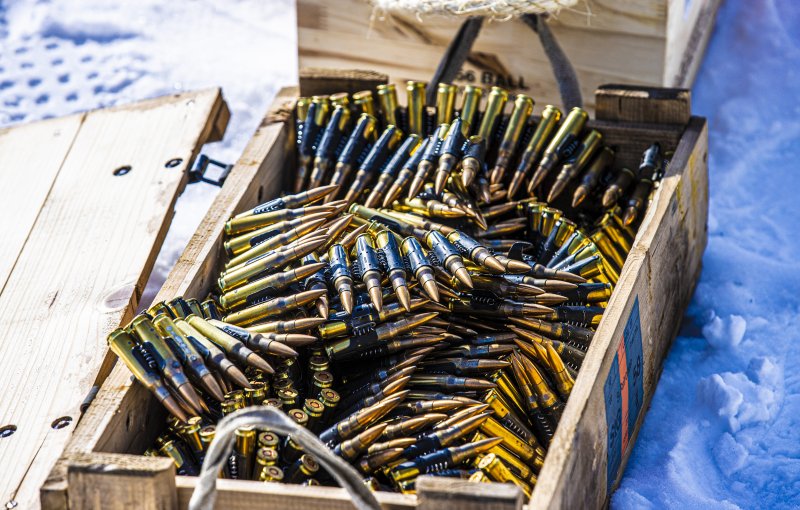 Ammunition in a box, which appears to be for machine guns. The ammunition are seemingly similar in shape and size to 15 mm ones.