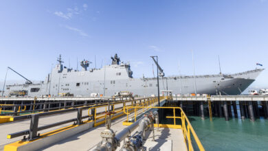 HMAS Adelaide berths alongside the new Kuru Wharf at HMAS Coonawarra in Darwin, NT. *** Local Caption *** HMAS Adelaide conducted the first Landing Helicopter Dock (LHD) sized berthing alongside the brand new Kuru Wharf at HMAS Coonawarra, Darwin, NT. This event marks a significant achievement regarding ongoing upgrades of waterfront facilities at Larrakeyah Defence Precinct. The Kuru Wharf measures at approximately 250 metres in length, with two approach jetties. The new wharf is now able to support up to Landing Helicoper Dock size naval vessels, providing game-changing capability support in the North.