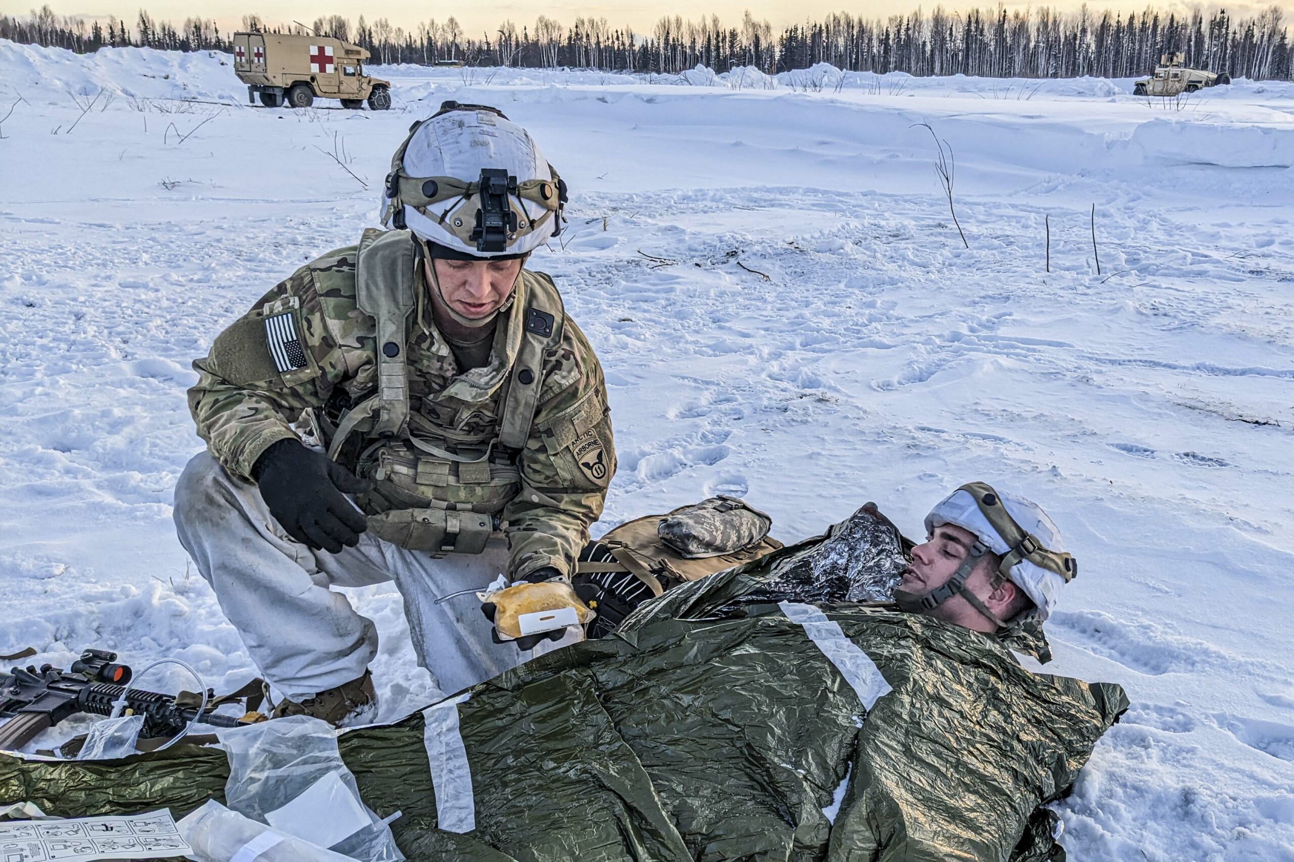 Soldiers with the U.S. Army 11th Airborne Division test a Freeze-Dried Plasma kit as part of combat casualty care training during Joint Pacific Multinational Readiness Center (JPMRC), Fort Wainwright, Alaska, April 2, 2023. FDP is one of several human and canine blood products currently under development by the U.S. Army Medical Materiel Development Activity at Fort Detrick, Maryland. USAMMDA’s Warfighter Protection and Acute Care Project Management team partners with both U.S. Department of Defense and non-DOD industry development partners to develop and deliver blood products for possible future use by the military Joint-Forces. (U.S. Army Courtesy Photo/Released)