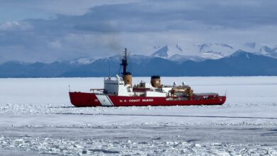 230118-N-NX070-1001 The heavy ice breaker USCGC Polar Star (WAGB 10) breaks ice approaching McMurdo Station, Antarctica. Joint Task Force-Support Forces Antarctica oversees the activities of the joint services and provides Department of Defense support to the National Science Foundation and United States Antarctic Program through Operation Deep Freeze. (U.S. Navy photo by Senior Chief Mass Communication Specialist RJ Stratchko)