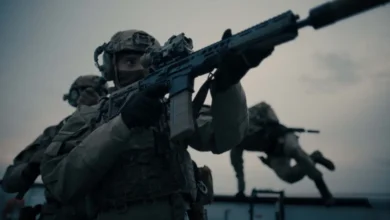 A British soldier holding a rifle