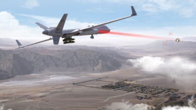Rendering of the MQ-9B SkyGuardian engaging drones with the an airborne laser pod