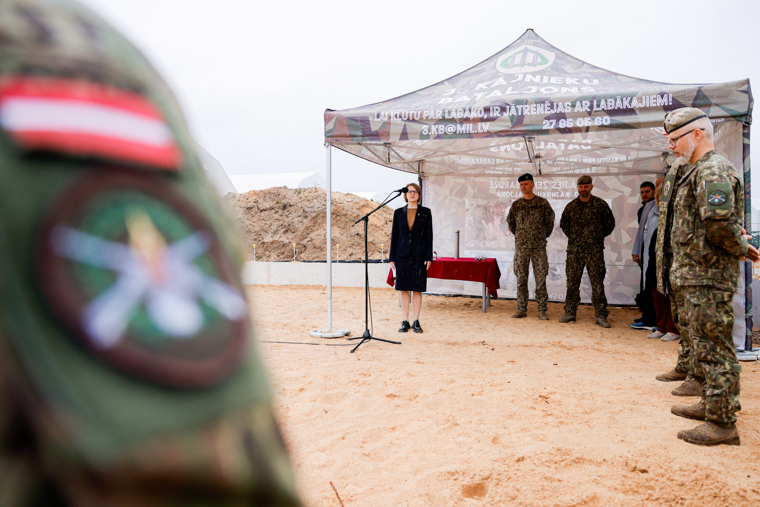 The National Armed Forces begin construction of the fifth barracks at the military base "Ādaži" On June 5, the construction of the fifth barracks began at the military base "Ādaži" with a ceremonial groundbreaking ceremony. The future barracks are intended to accommodate soldiers of the national defense service and will be able to accommodate 450 people. The barracks will be a four-story building with an area of ​​7,860 square meters. Its first floor will house various storage rooms and a training area, including classrooms. The second, third and fourth floors of the barracks are intended for the accommodation of soldiers. The construction of the barracks is planned to be completed in a year. The first four-story barracks at the Ādaži base was opened in December 2018. Photo: Armīns Janiks (Ministry of Defence)