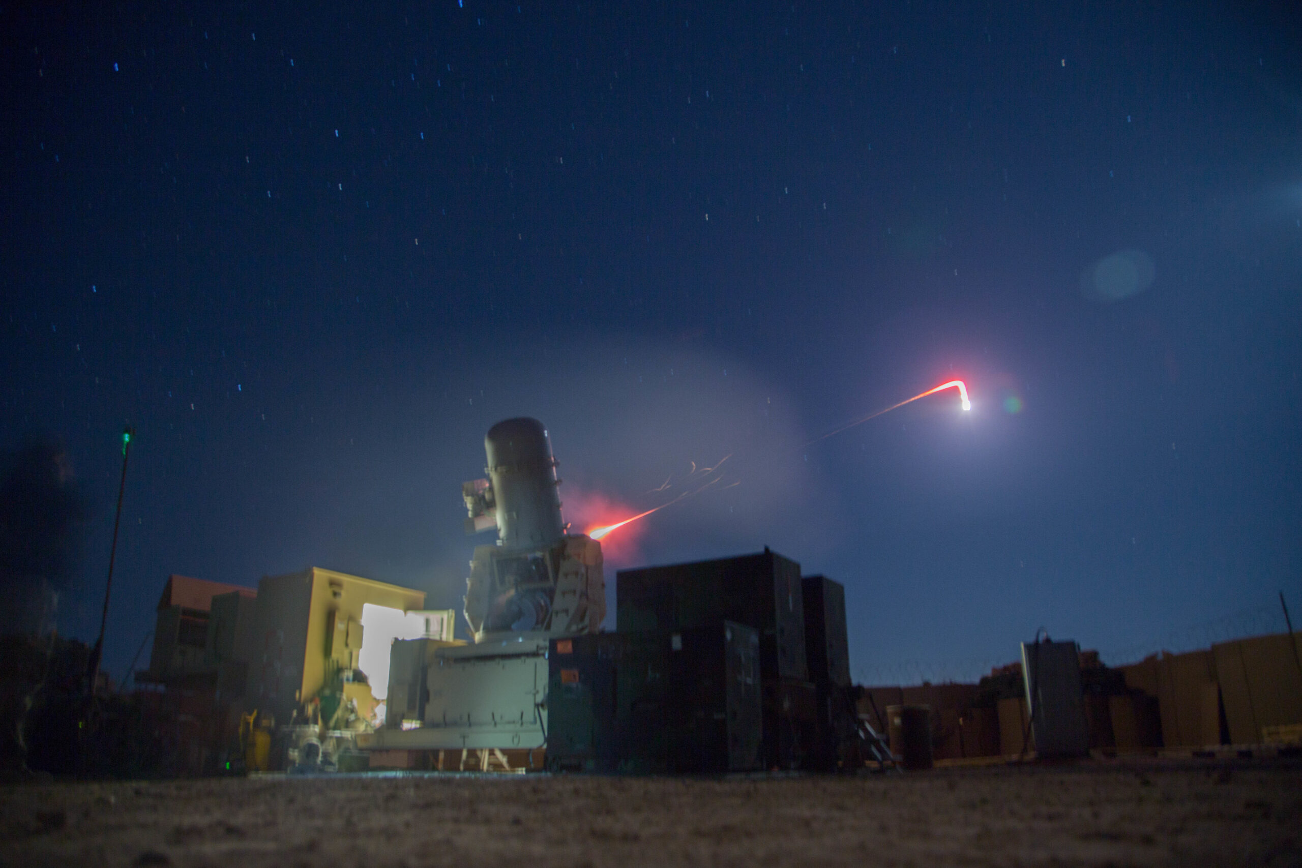 A land–based Phalanx weapons system assigned to B Battery, 5th Battalion, 5th Air Defense Artillery Regiment conducts a test fire mission to maintain mission readiness at Camp Manion, Iraq, Jan. 6, 2017. The LPWS targets and destroys incoming enemy munitions before they are able to cause damage to an area. B Battery, 5th Battalion, 5th Air Defense Artillery Regiment conducted the fire mission in support of Combined Joint Task Force – Operation Inherent Resolve, the global Coalition to defeat ISIL in Iraq and Syria. (U.S. Army photo by Spc. Christopher Brecht)