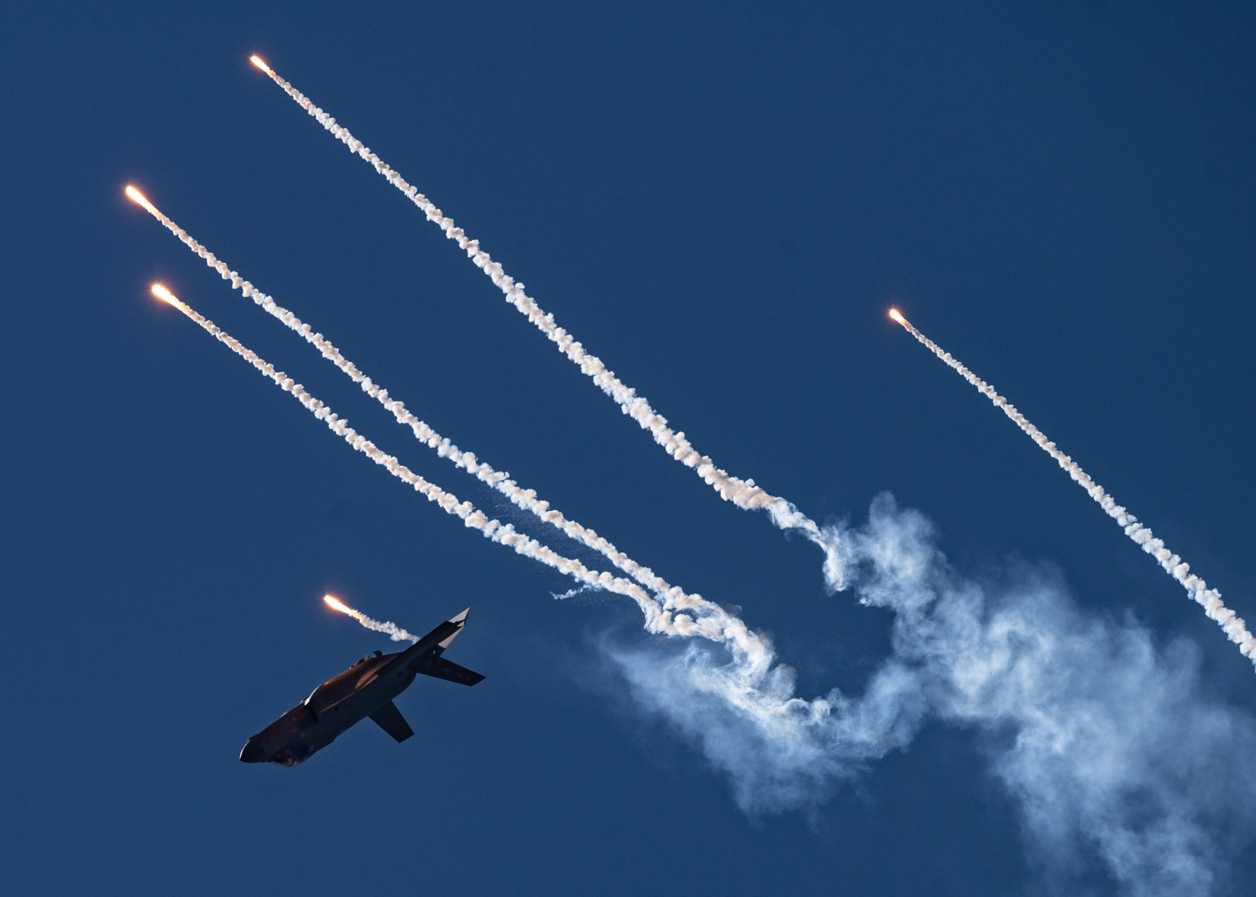 U.S. Air Force Maj. Kristin "BEO" Wolfe, F-35A Lightning II Demonstration Team pilot and commander, deploys flares during her aerial demonstration at the Pacific Air Show, Oct. 2, 2021, Huntington Beach, Calif. This was the first time the F-35 Demo Team deployed flares at a public performance. (U.S. Air Force photo by Capt. Kip Sumner)