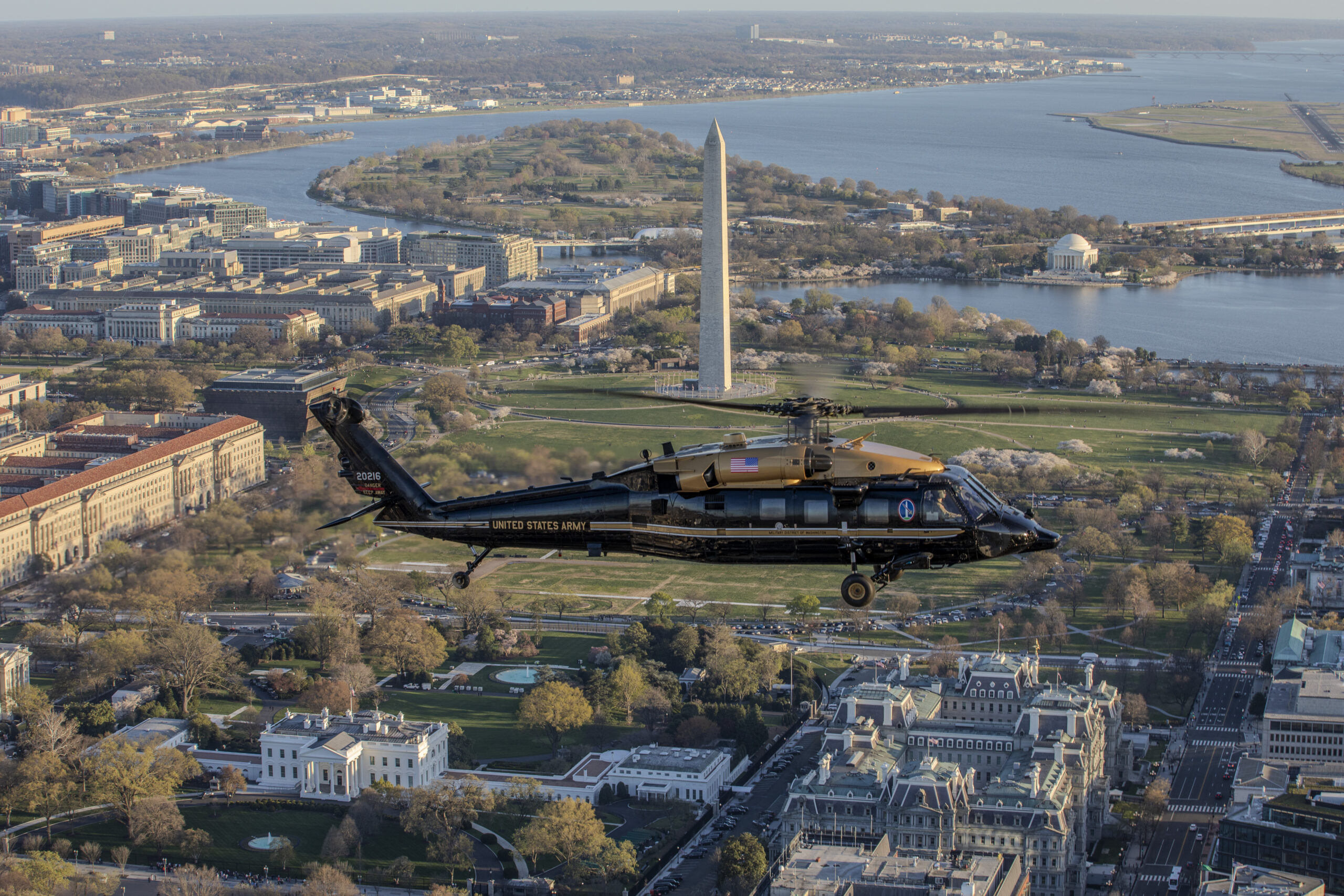 U.S. Army Capt. Chris Bissett and Warrant Officer Eric Mendoza, pilots, and U.S. Army Staff Sgt. Daniel Pechacek, crew chief, all assigned to Alpha Company, 12th Aviation Battalion, The Army Aviation Brigade, fly a VH-60M Black Hawk helicopter past the White House, Washington, D.C., March 25, 2024. The 12th Aviation Battalion uses VH-60M "gold top" Black Hawks to conduct priority air transport in support of Department of the Army senior leadership and other senior Department of Defense officials. (U.S. Air Force photo by Mr. Nicholas A. Priest)