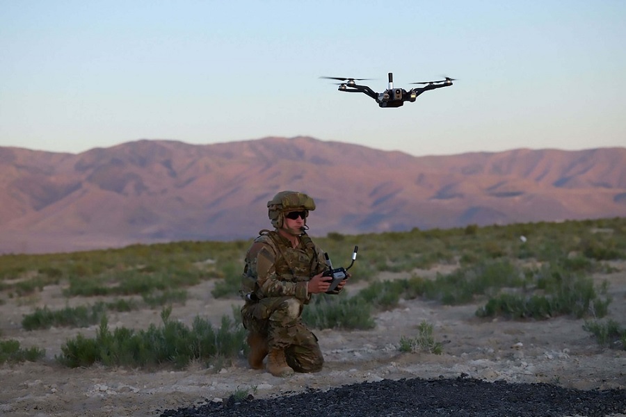 A US soldier operates a drone.