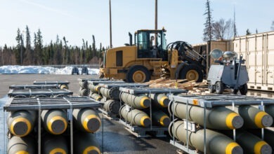 U.S. Airmen with the 3rd Munitions Squadron offload BLU-111 munitions from a shipping container at Joint Base Elmendorf-Richardson, Alaska, April 12, 2022. Over the course of eight days, the 3rd MUNS received the largest barge operation for the Air Force totaling 150,000 pounds of explosive weight. This is the 3rd MUNS annual inventory restock of both training and real-world munitions. (U.S. Air Force photo by Senior Airman Samuel Colvin)